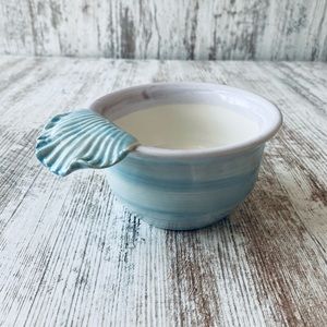 Pottery piece bowl with shell handle